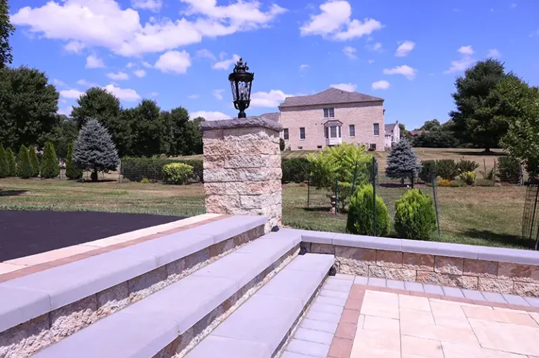 Entry steps with custom stone pillar and lighting — Silver Spring, MD