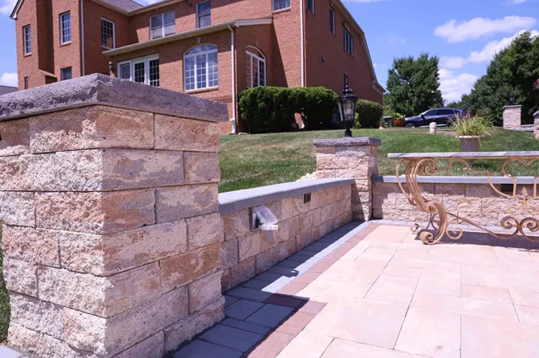 Detailed stone wall with water access for outdoor patio — Silver Spring, MD