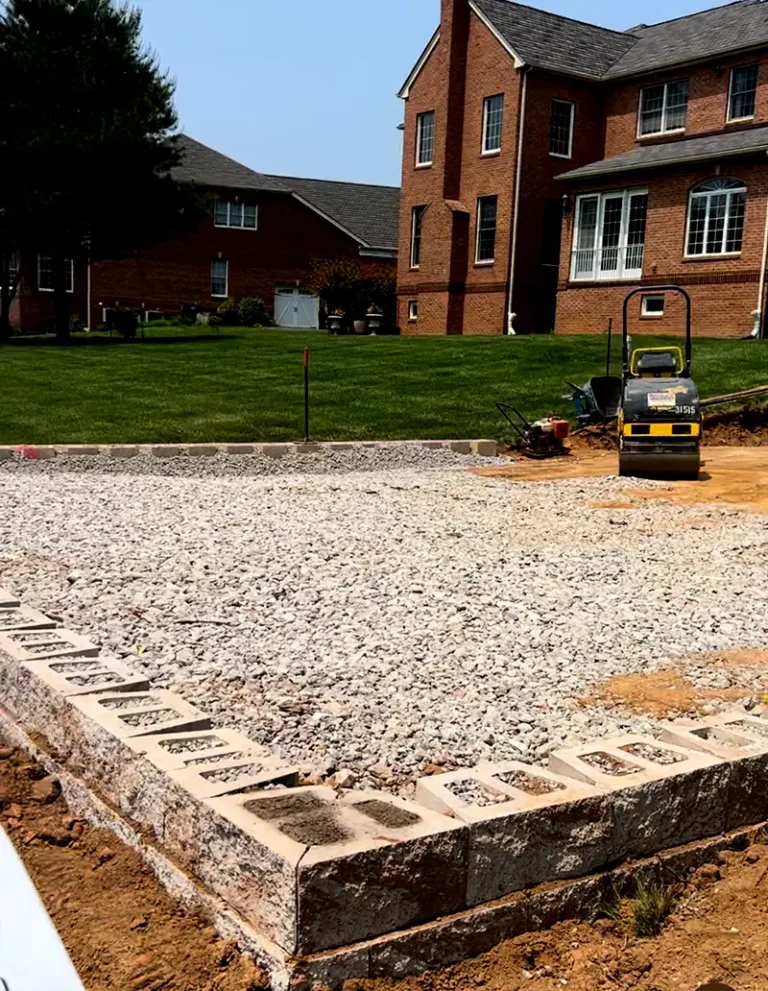 Patio base preparation with gravel and compaction — Hardscaping in Silver Spring, MDravel – Landscaping and Hardscaping in Silver Spring, MDlt-in fire pit – Landscaping and Hardscaping in Silver Spring, MD
