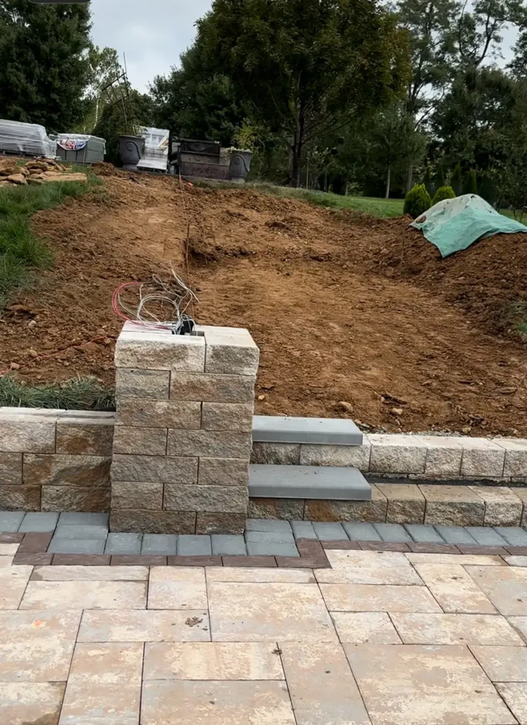 Completed retaining wall with natural stone cap – Landscaping and Hardscaping in Silver Spring, MD