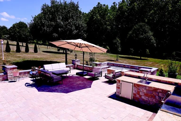 Elegant patio design with outdoor kitchen and umbrella in Silver Spring, MD