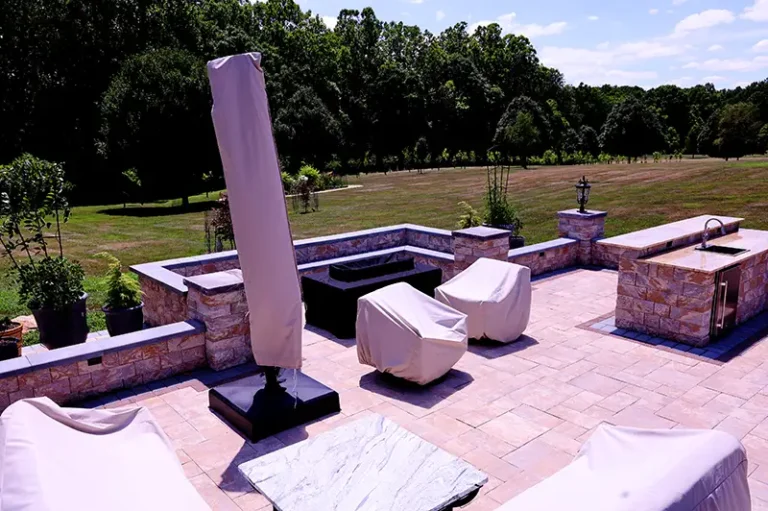 Custom outdoor lounge space with stone seating in Silver Spring, MD