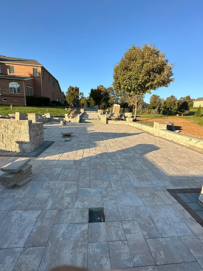 Setting the first course of retaining wall blocks – Landscaping and Hardscaping in Silver Spring, MD